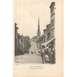 69 VILLEFRANCHE-SUR-SAÔNE. Rue Nationale animée vers 1900